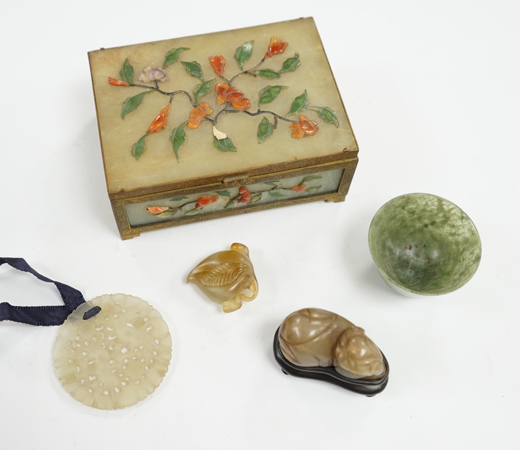 A group of Chinese jade and hardstone carvings to include a cigarette box & cover and a 14K mounted Yamanaka & Co pouch, largest 13cm wide. Condition - mostly fair